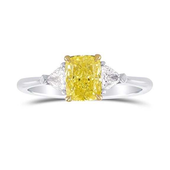 A beautiful 1.25 carats Fancy Intense Yellow Cushion diamond 3 Stone Ring Set in Platinum . It comes with an elegant gift box. Manufactured by Leibish and Co. 