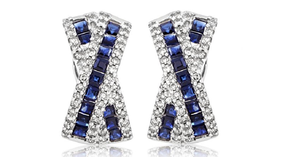 Exuding their regal nuance and intrinsic elegance against the marvelous backdrop of sparkling diamonds totaling 0.50ct, the gorgeous sapphires enrich the majestic design of these splendid 14K white gold earrings, weighing in total 2.50 carats.